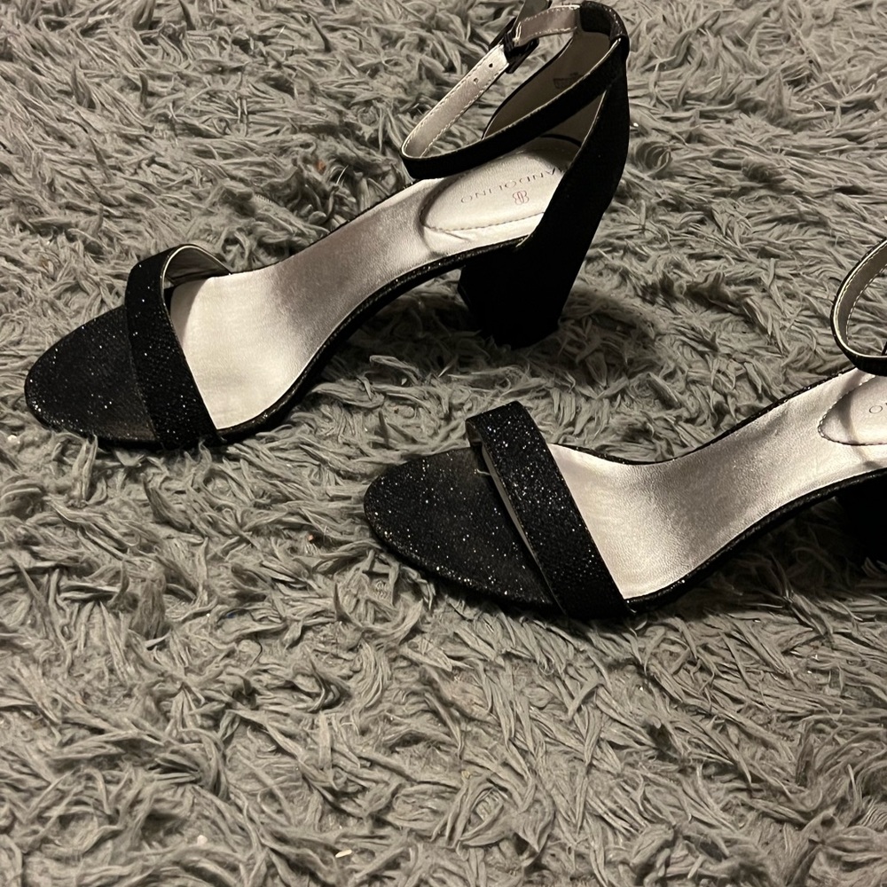 Used only once, dark blue sparkly heel.